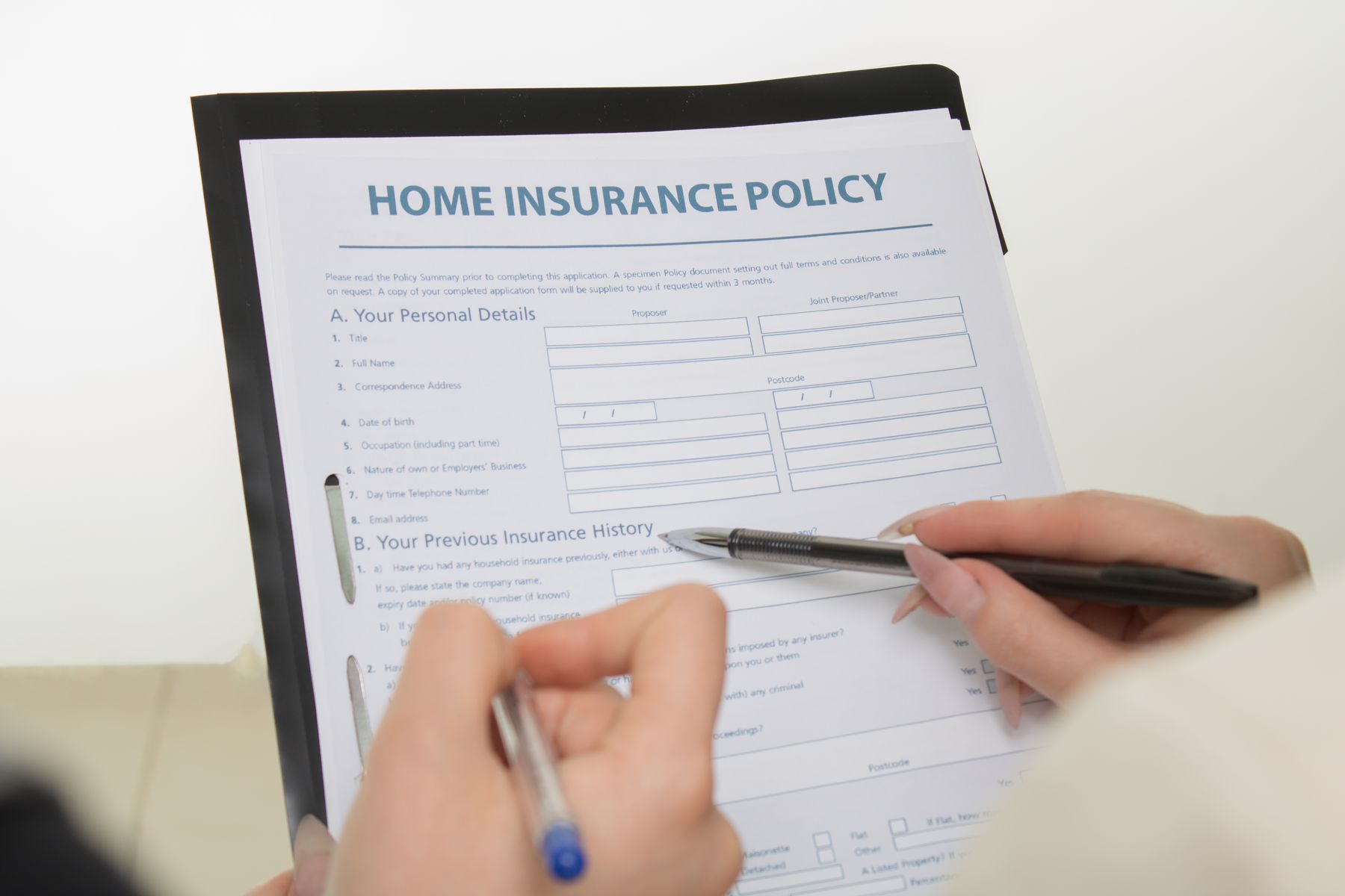 Homeowners reviewing insurance documents